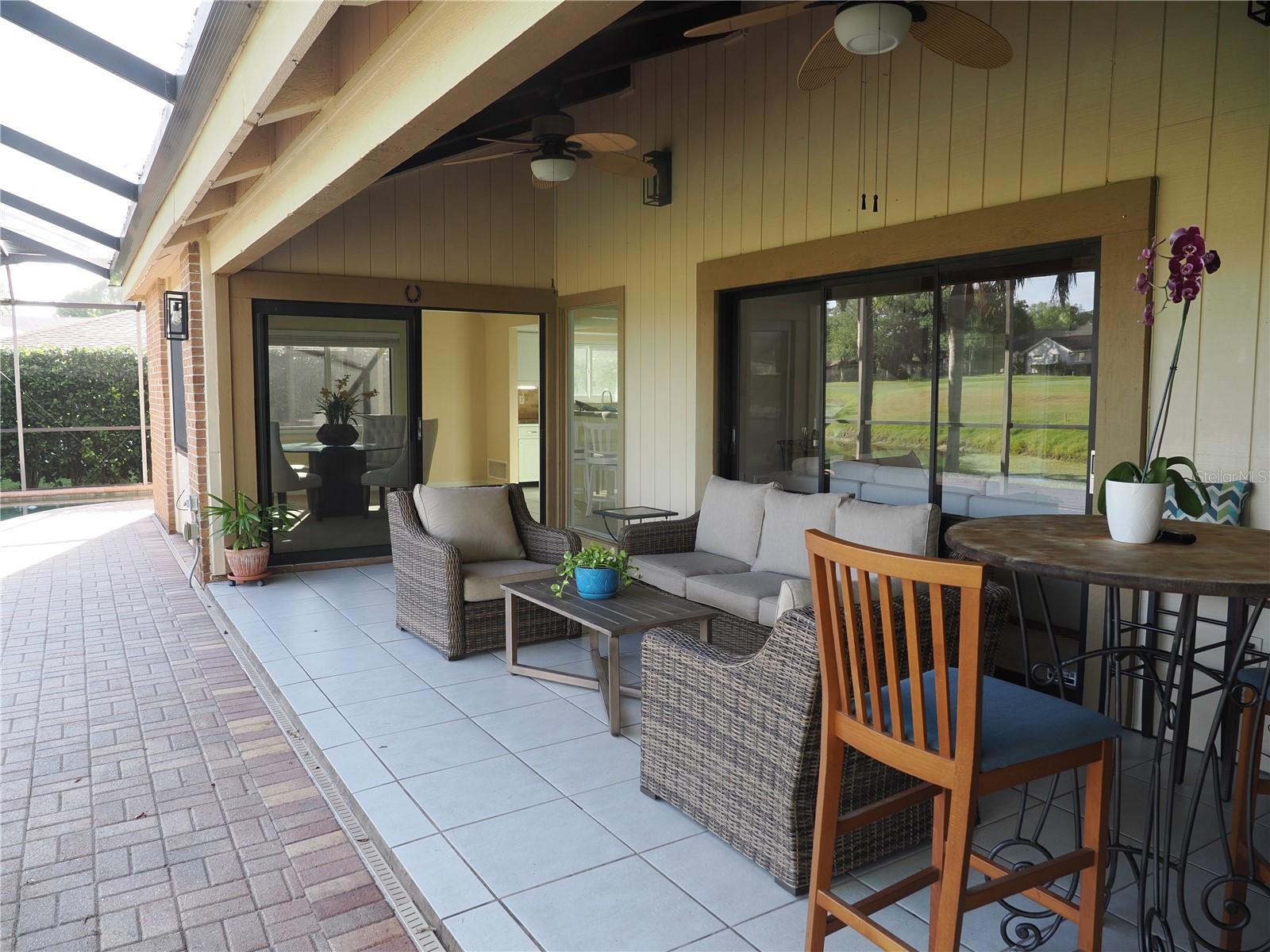 Covered screen lanai with two ceiling fans