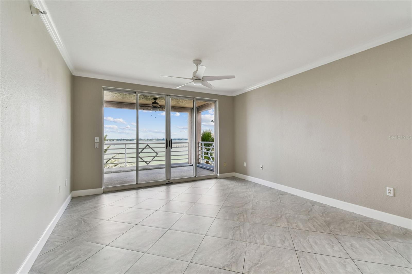 Living Room Opens to Private Balcony with Water Views