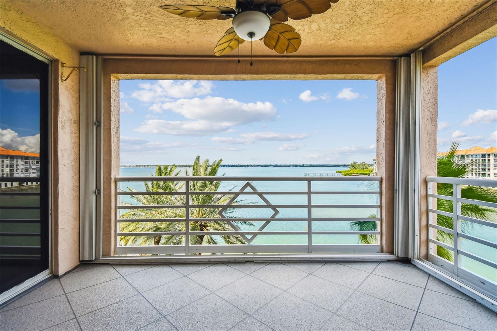 One of Two Private Covered Balconies with Hurricane Shutters