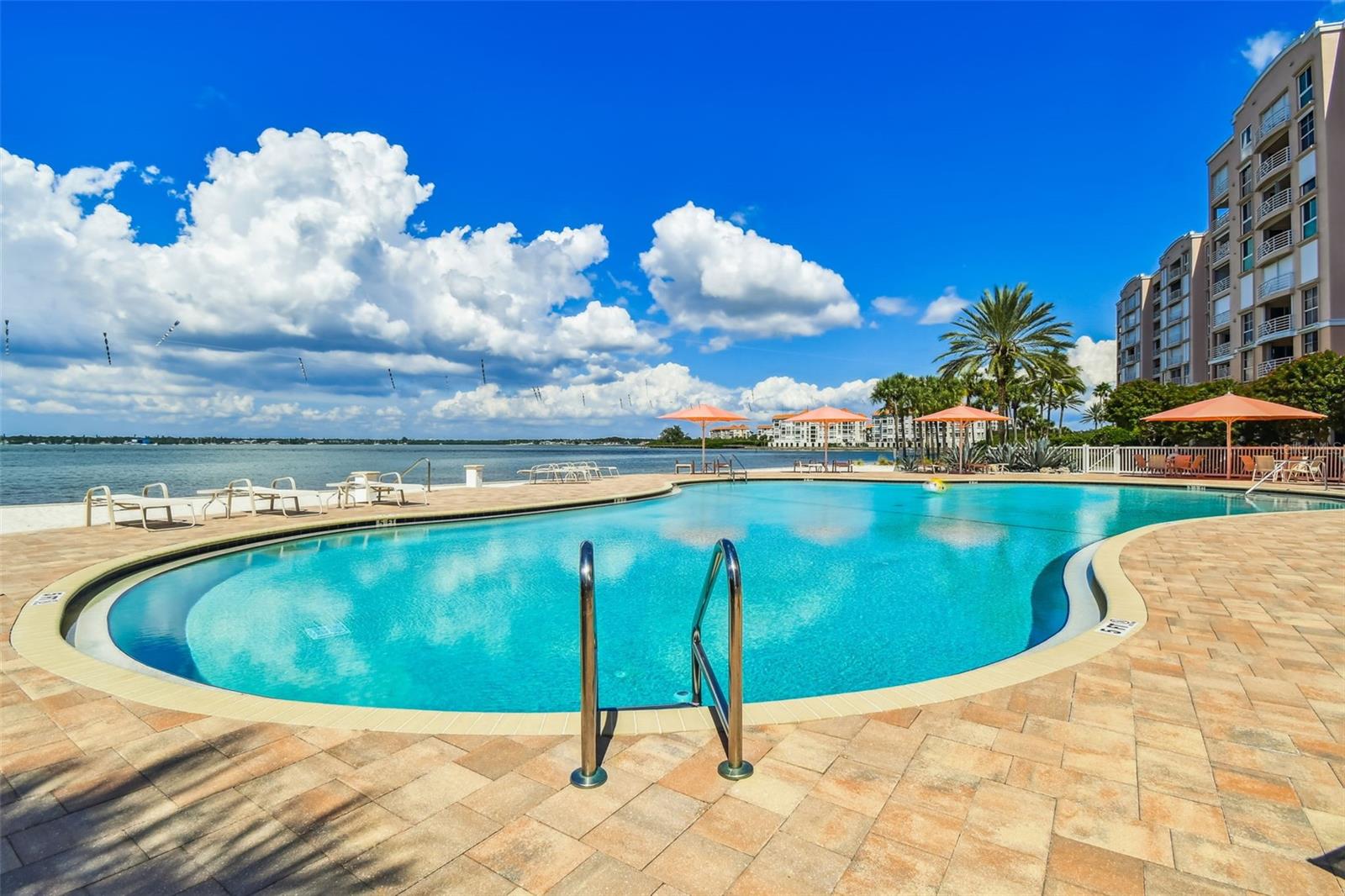 Heated Waterfront Pool with Expansive Pavered Sundeck