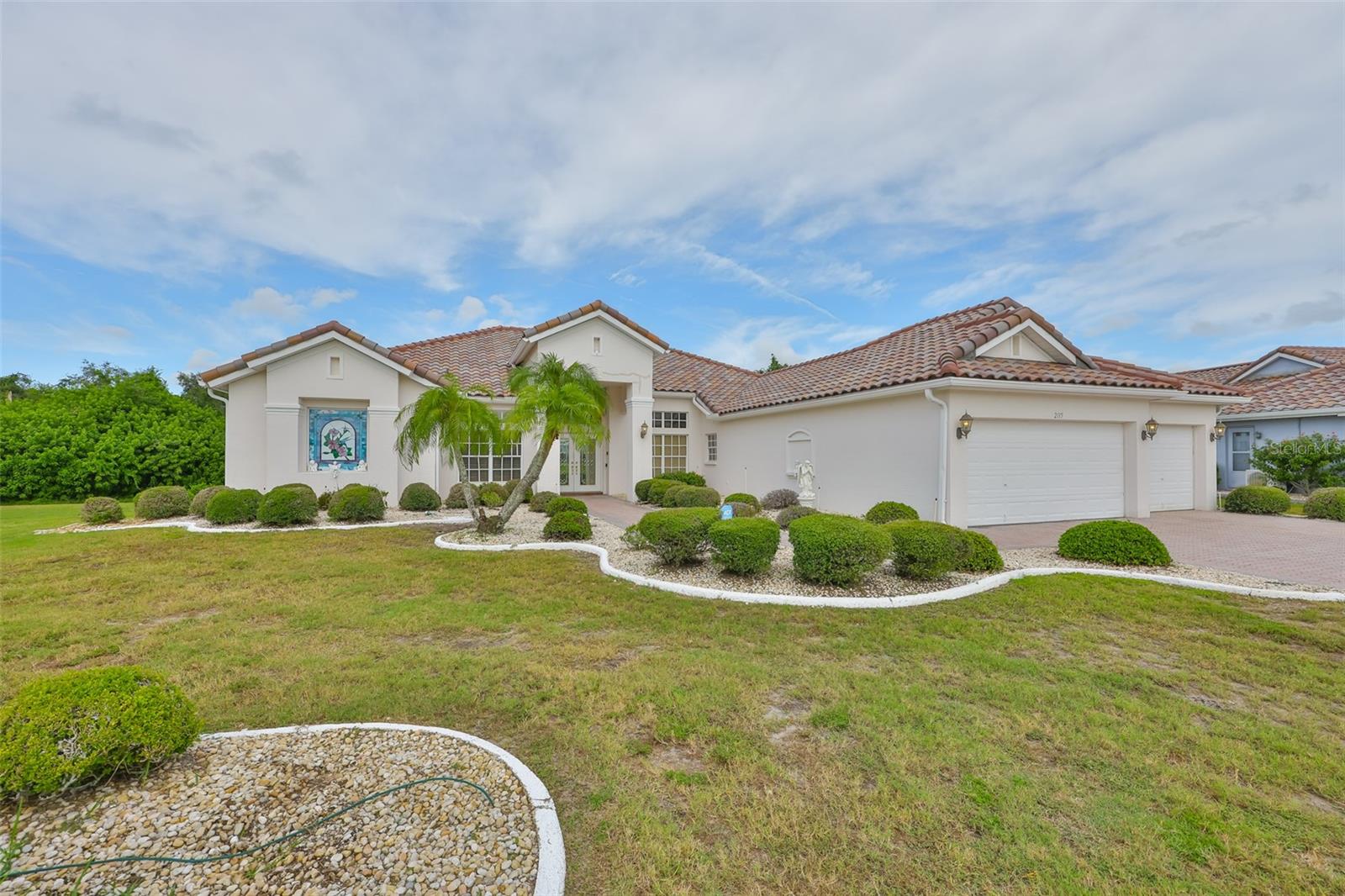 Front View -New Tile Roof, 3 Car Garage, Pavered Driveway