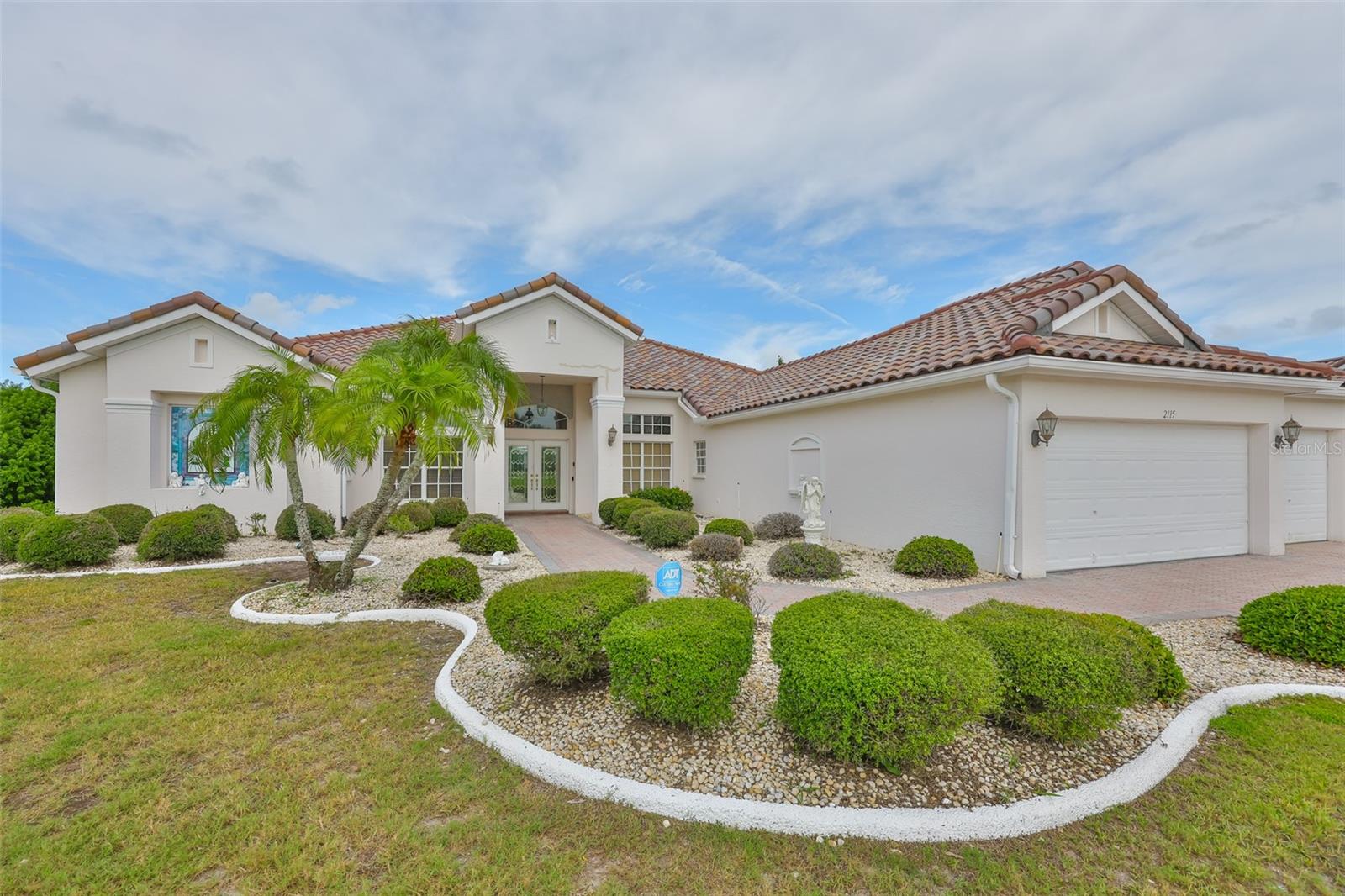Front View -New Tile Roof, 3 Car Garage, Pavered Driveway