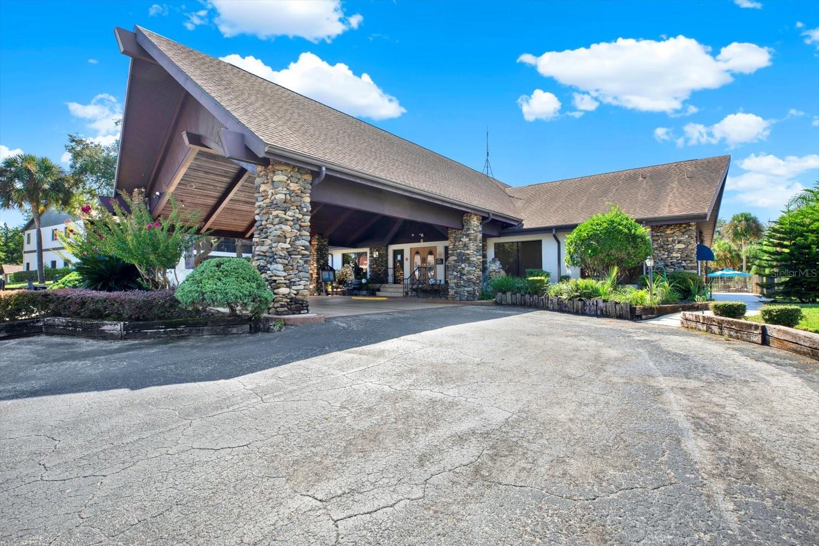Community clubhouse with pool and grilling area.