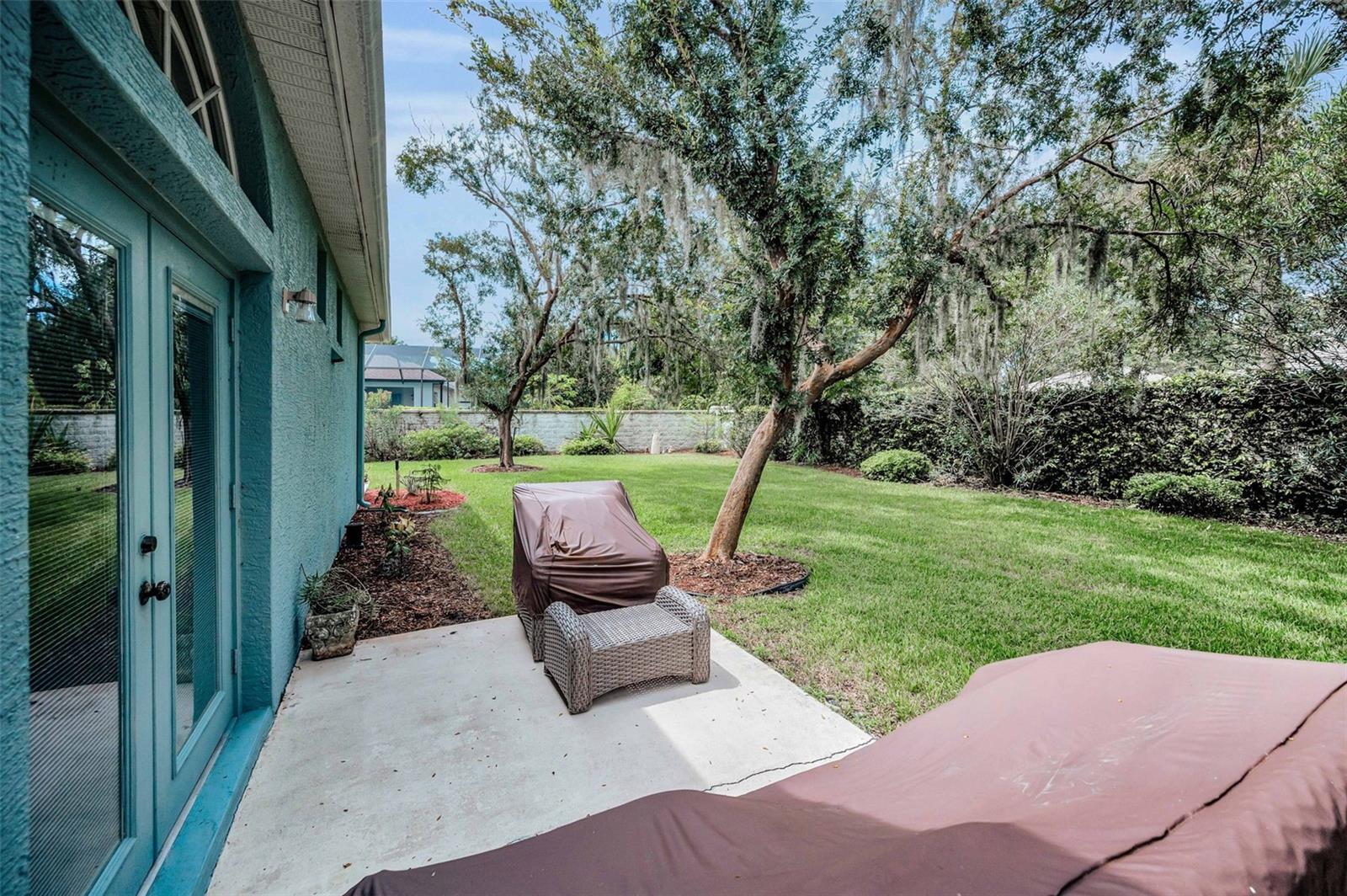 Side patio with access from the dining room