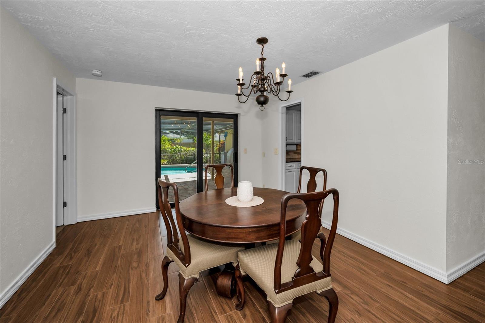 Dining Area has Sliding Doors Leading to the Pool Area