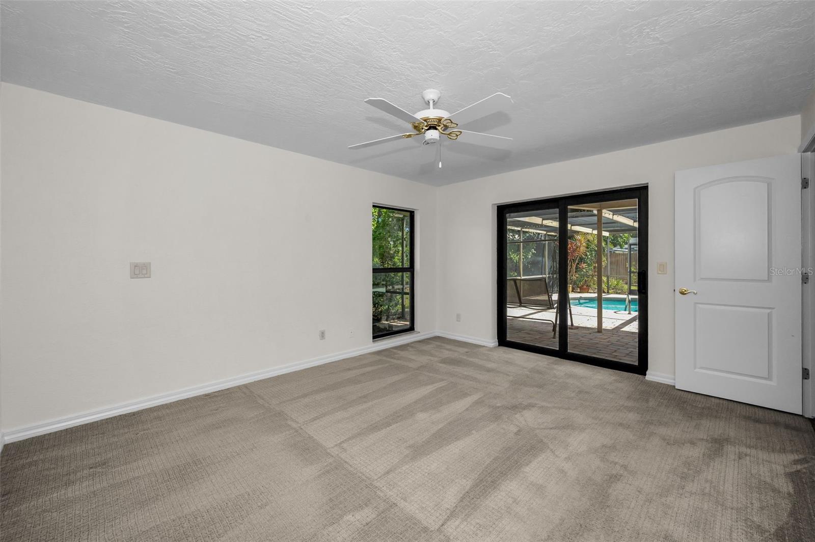 Master Bedroom Suite has Sliding Doors leading to the Tranquil Pool Area
