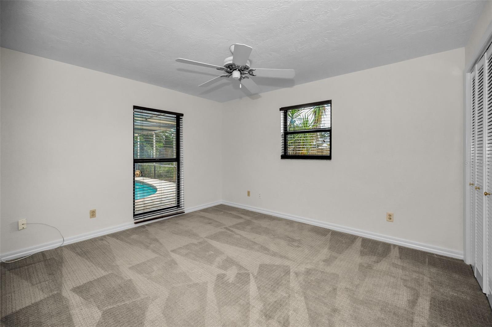 Guest Bedroom with View of Pool Area