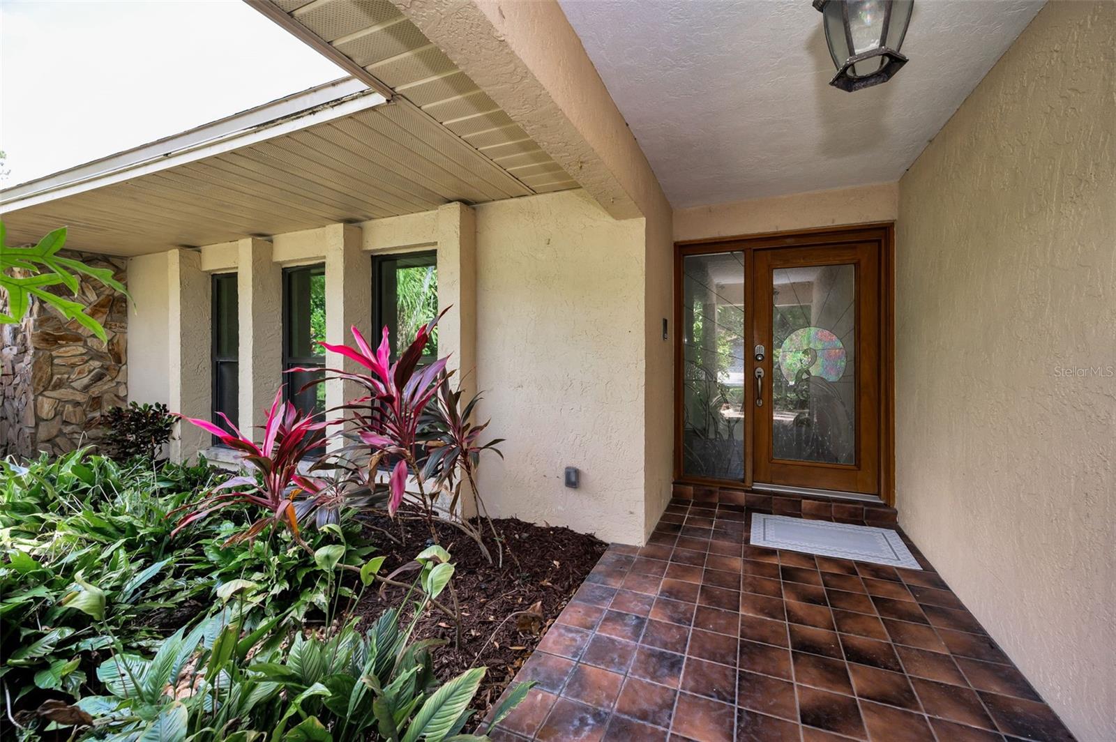 Front Exterior Entry withElegant Stained Glass Door and Side Light