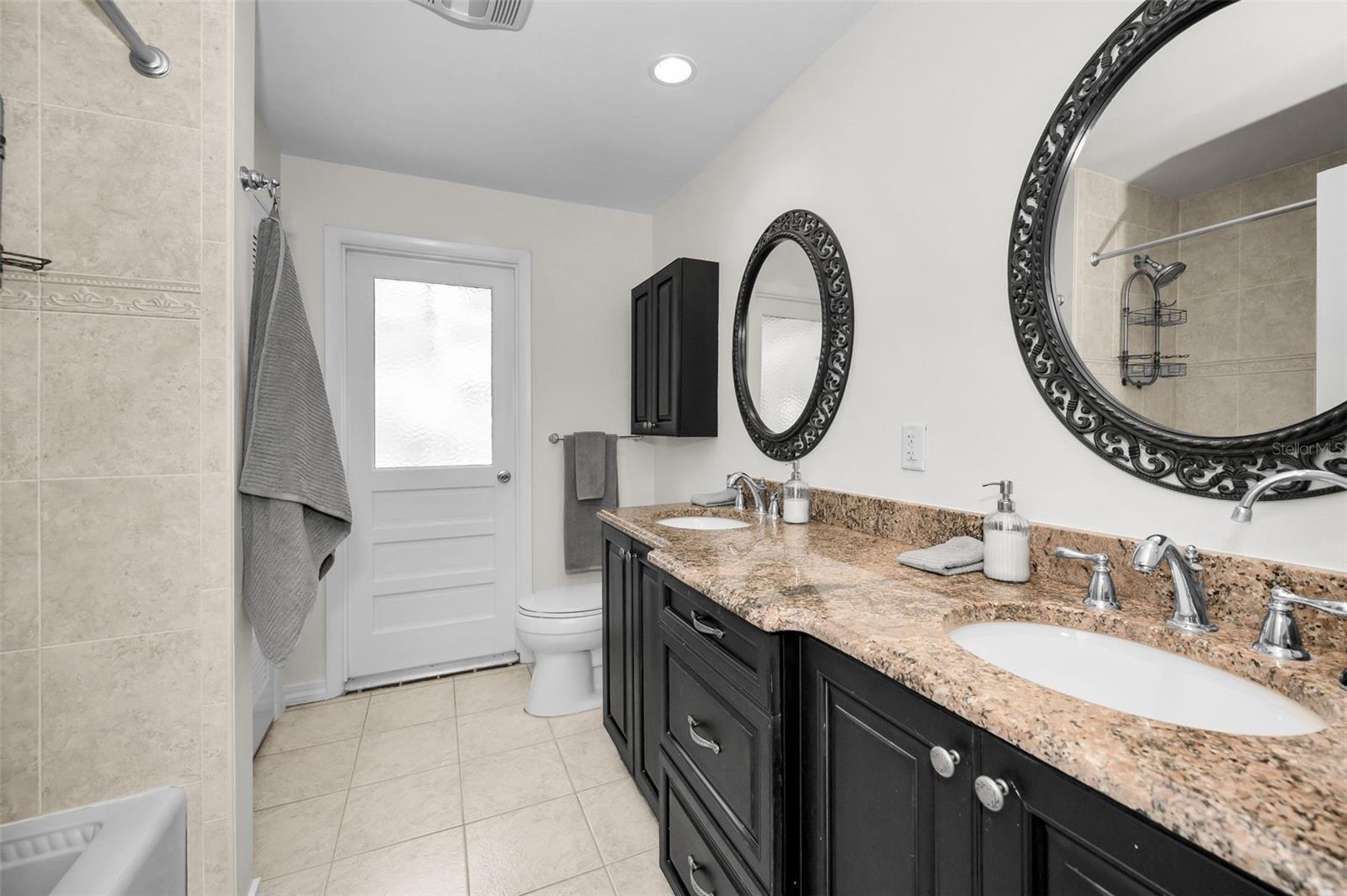 Guest Bath has door leading to the Pool Area - Very Convenient