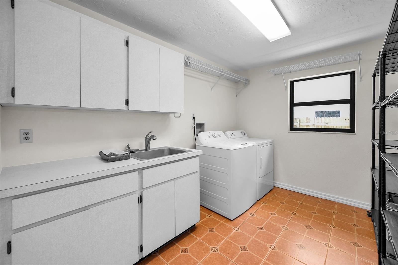 Large Laundry Room with Utility Sink and Storage