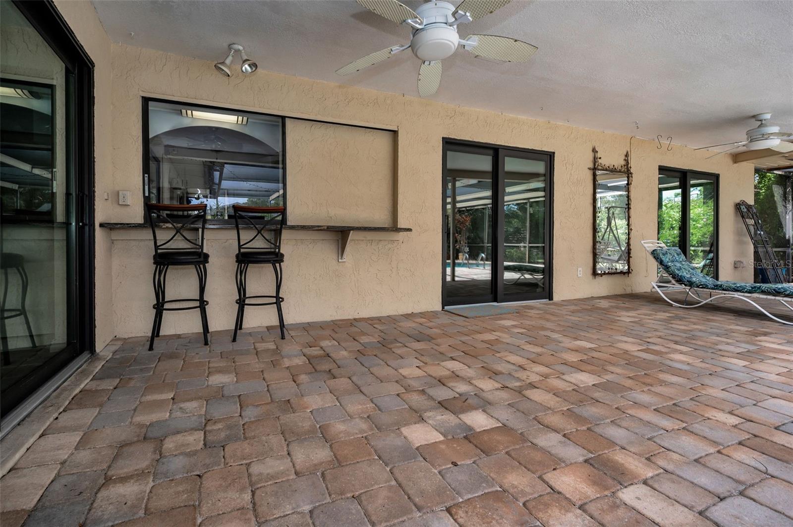 Pavered Pool Area with Pass-Through to the Kitchen