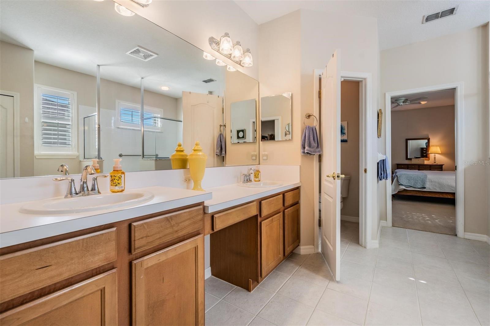 Primary bathroom with double vanity and water closet