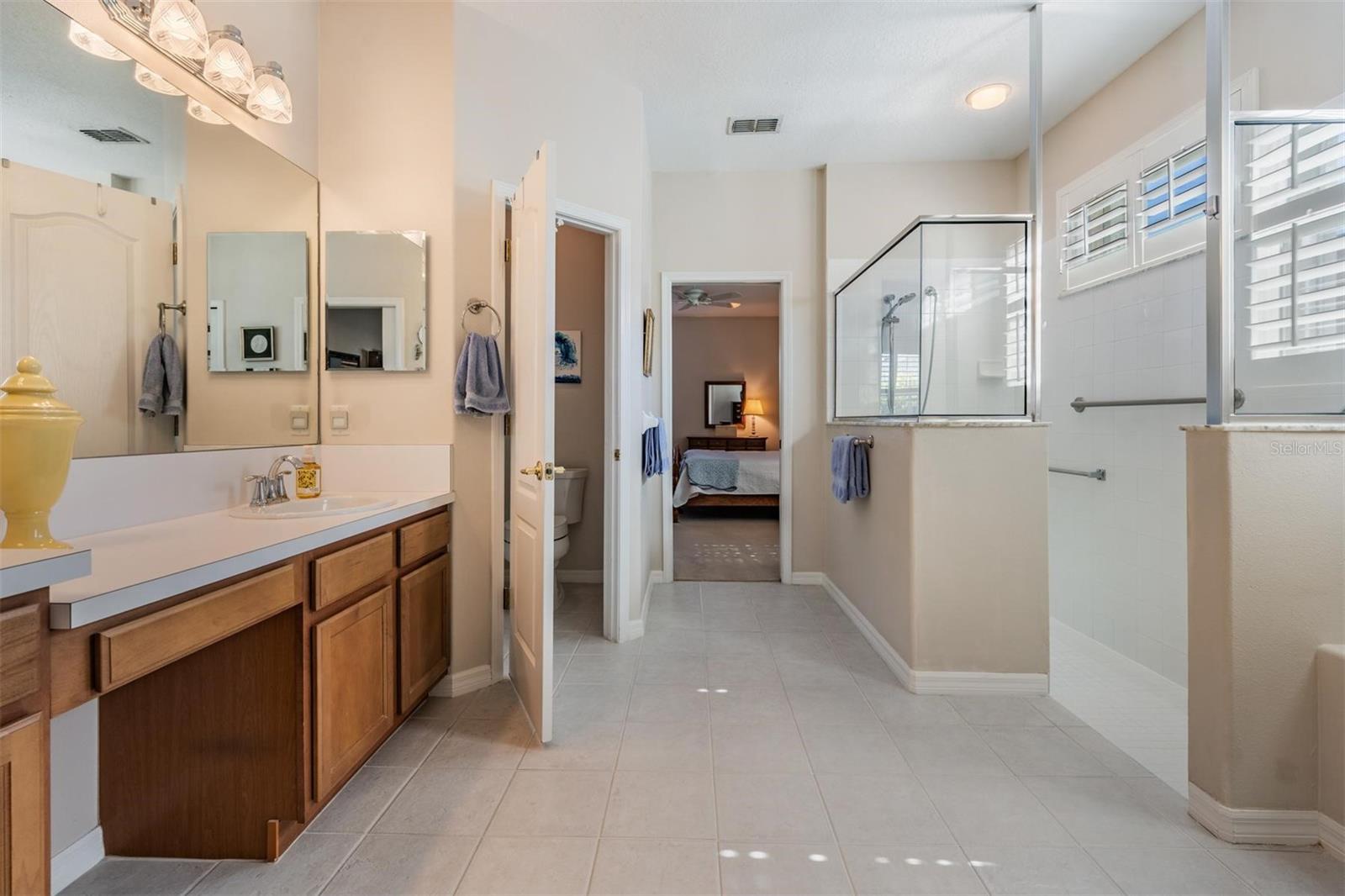 Linen closet and oversized walk-in shower