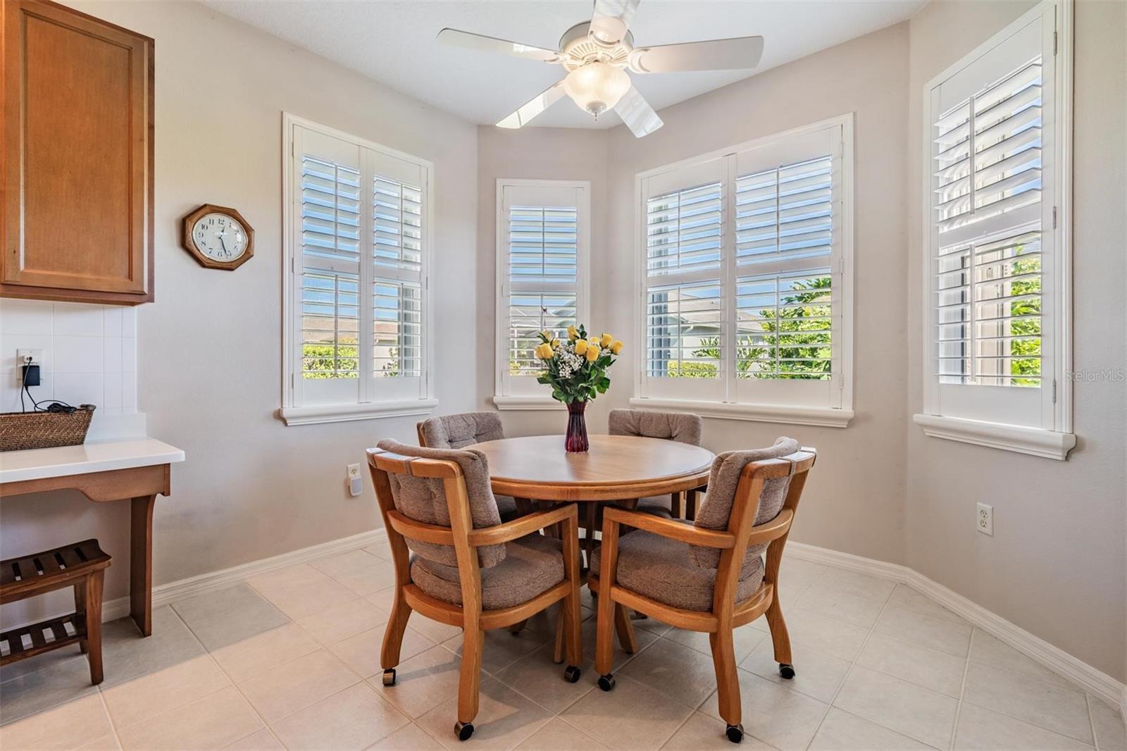 Plantation shutters adorn the windows in the breakfast nook