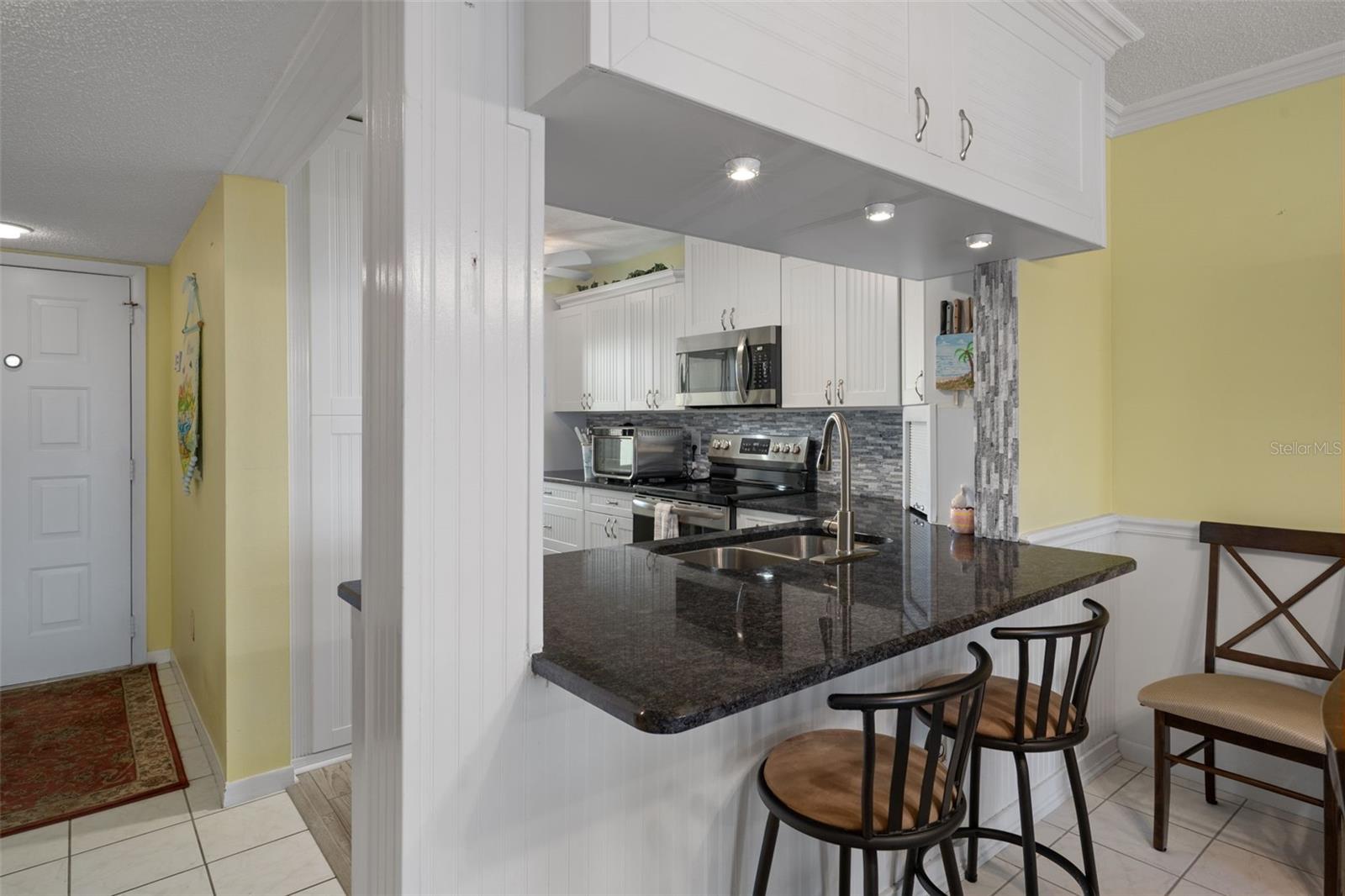 Breakfast bar into kitchen