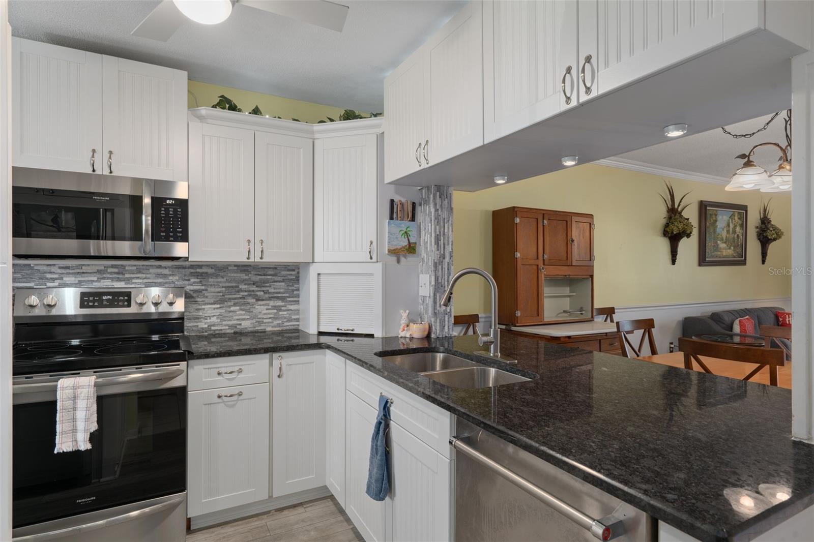 Updated kitchen with granite tops and stainless appliances