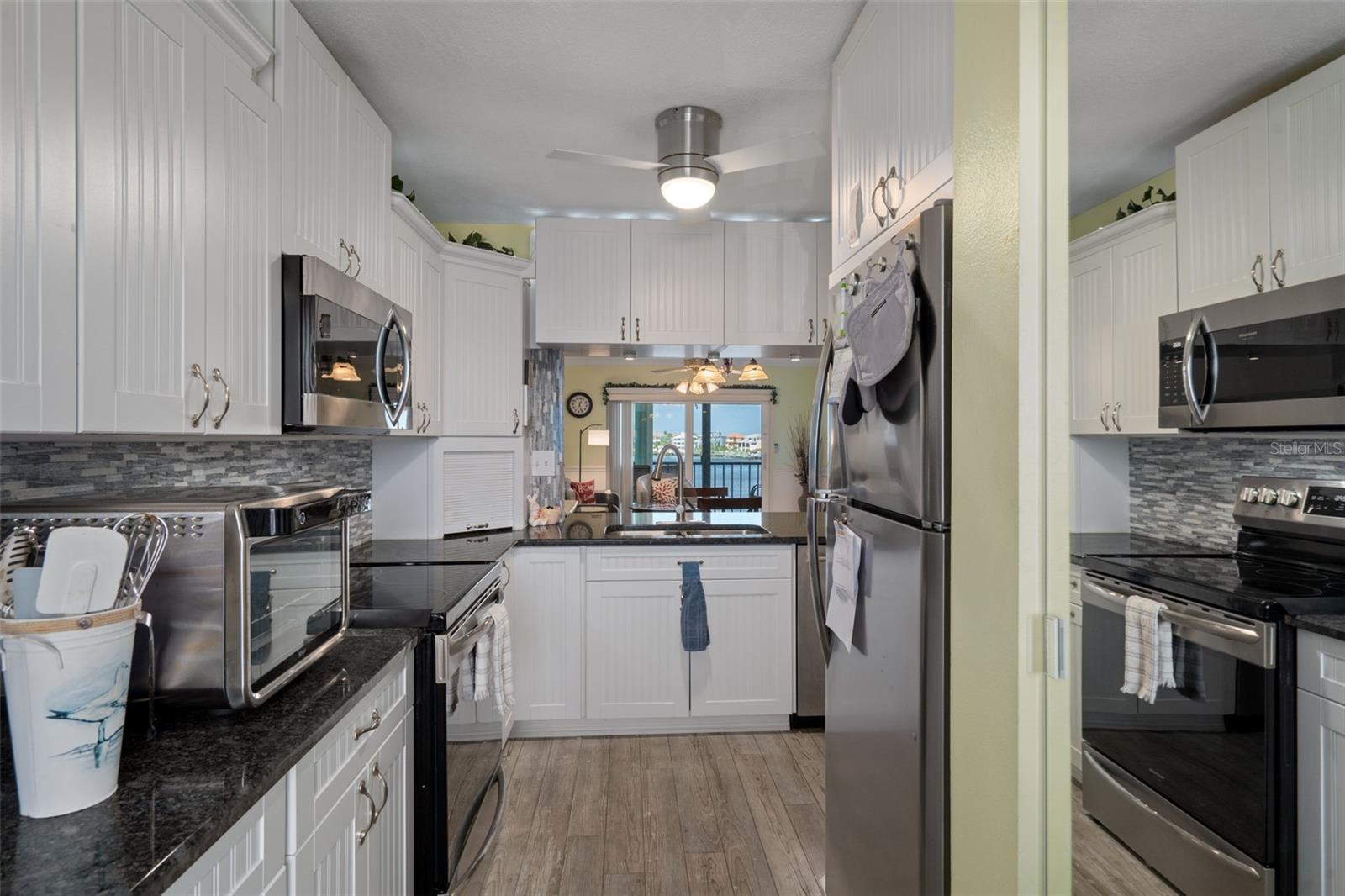 Updated kitchen with granite tops and stainless appliances