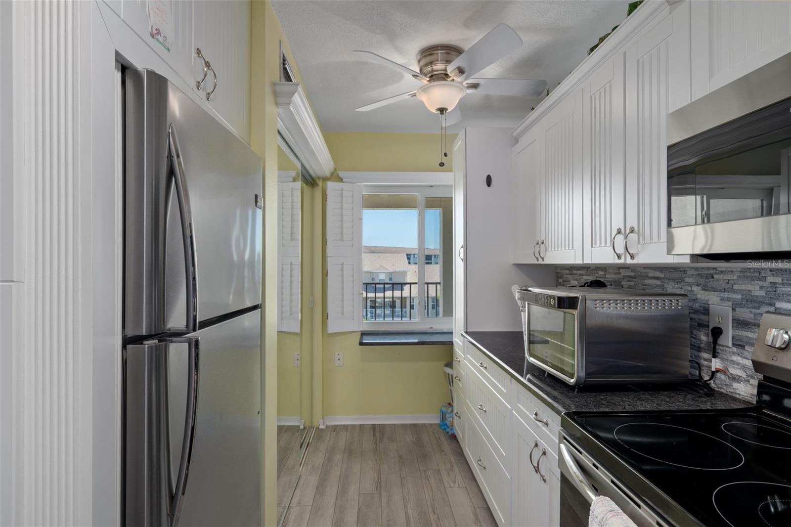 Updated kitchen with granite tops and stainless appliances