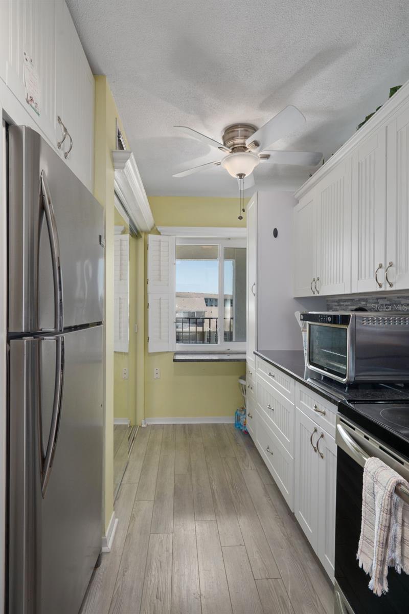 Updated kitchen with granite tops and stainless appliances