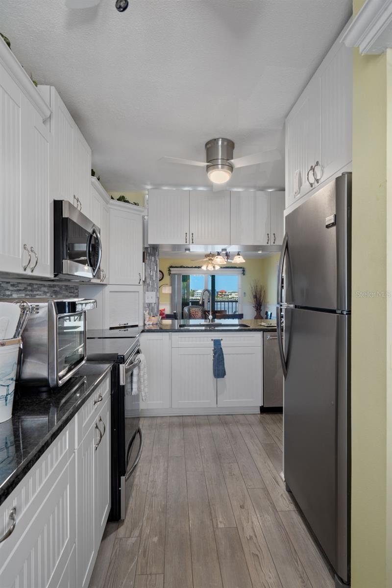 Updated kitchen with granite tops and stainless appliances