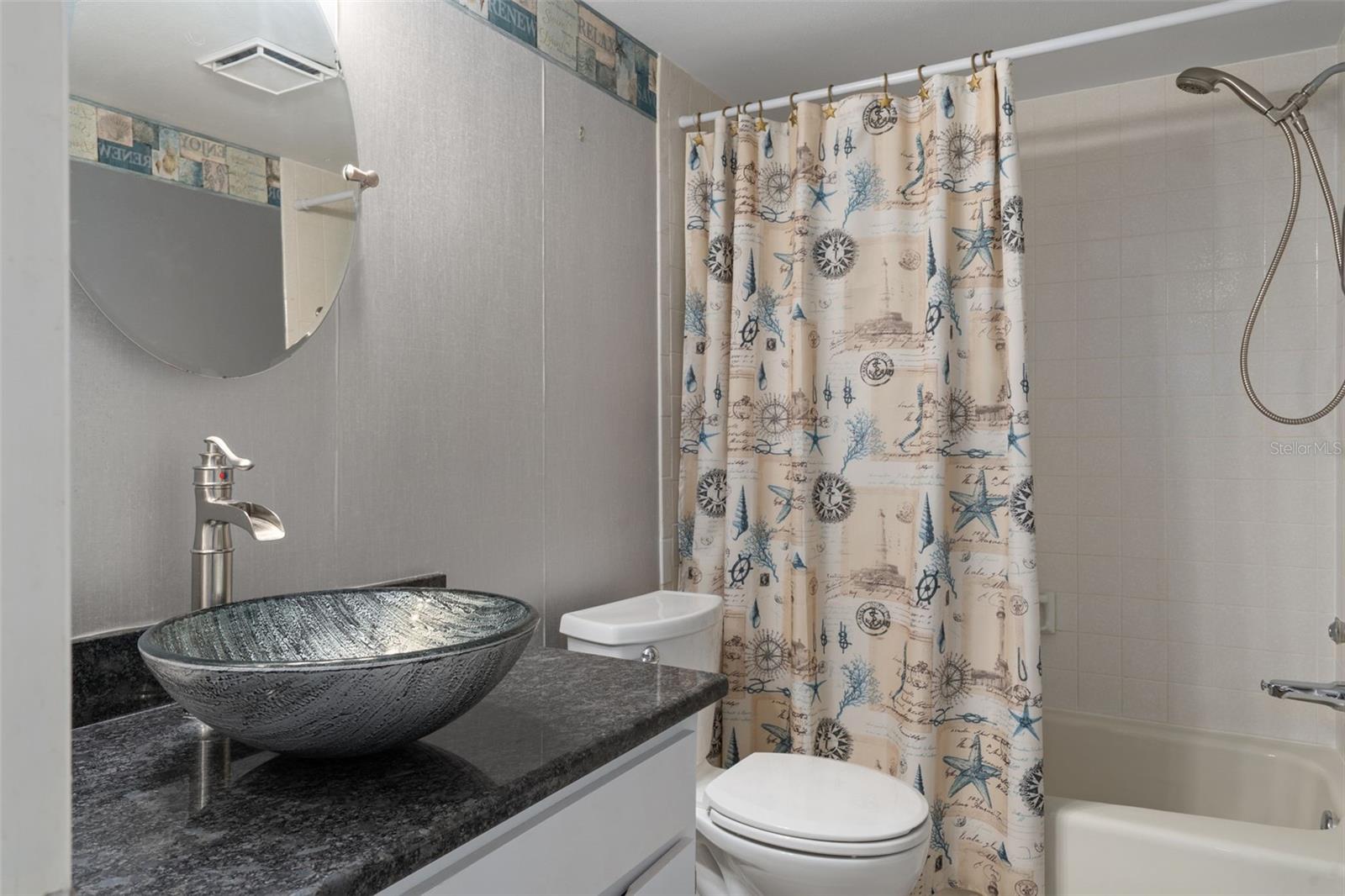 Guest bath with tub/shower and updated vanity
