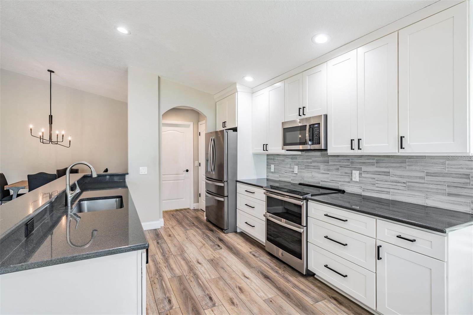 More than ample granite counter and cabinet space
