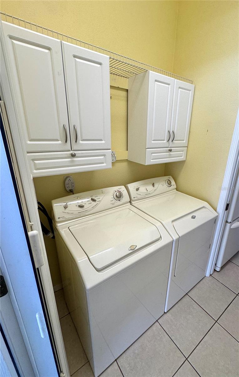 Inside laundry room with washer and dryer included
