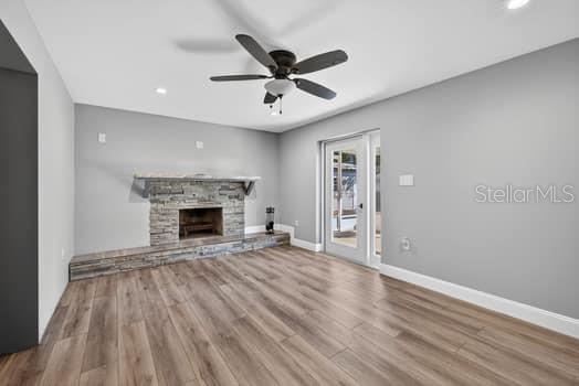 Family Room with Fire Place &  Exit to Covered Patio