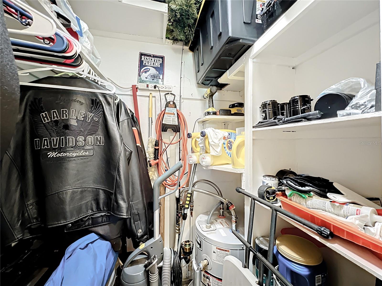 Hall closet with laundry hook up.