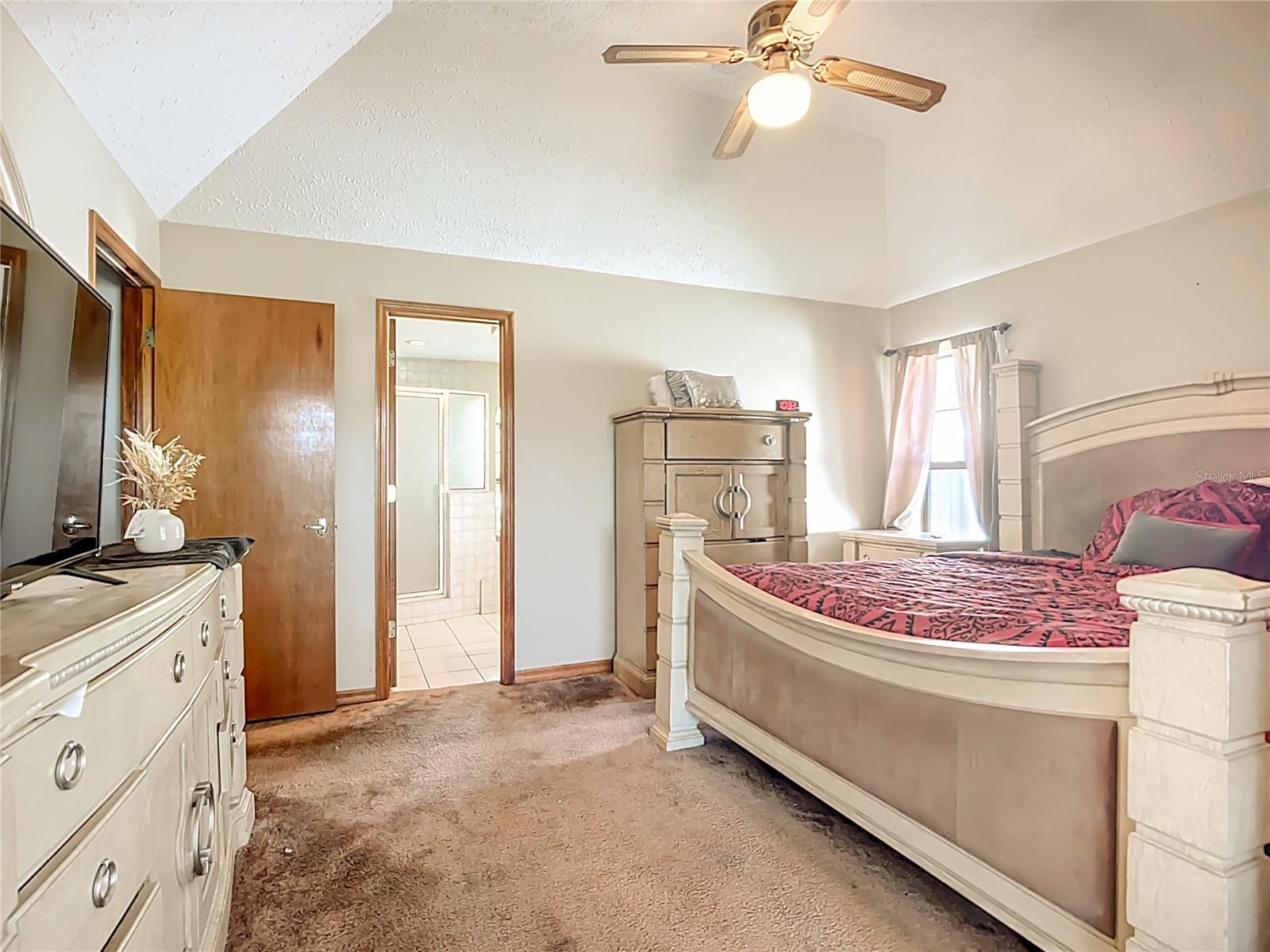 Primary bedroom located on the opposite side of the home.