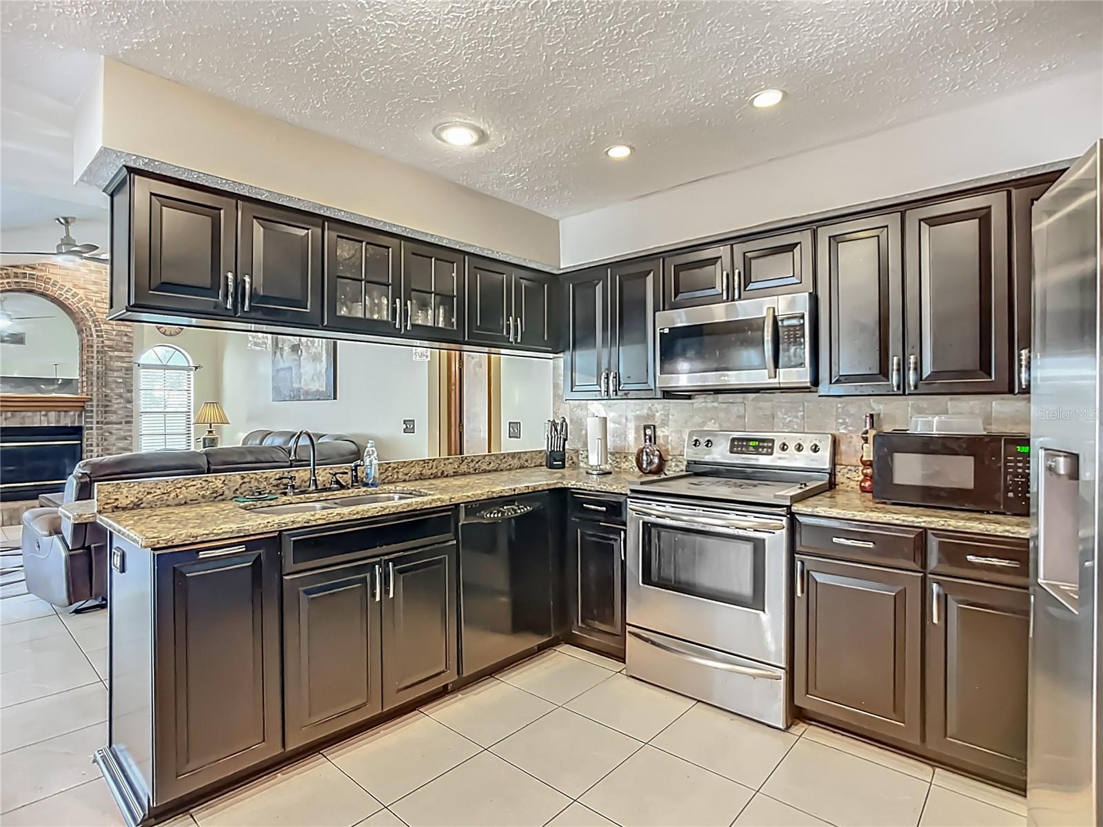 Updated Kitchen with wood cabinets.