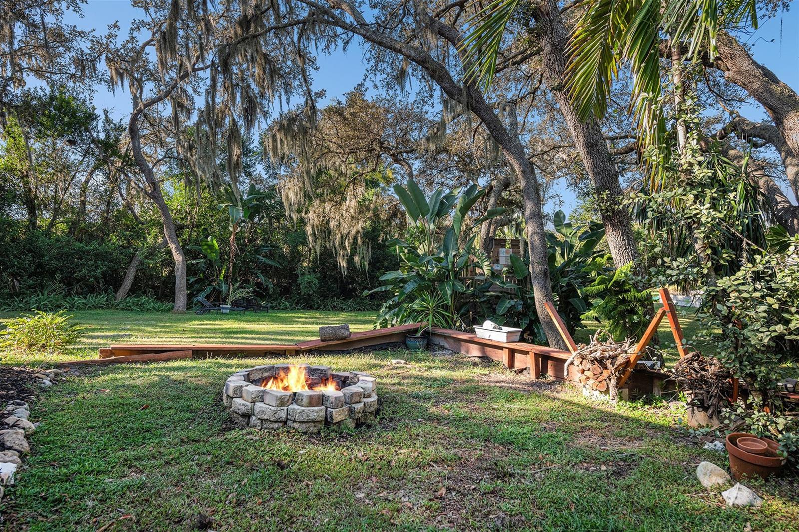Large backyard with firepit