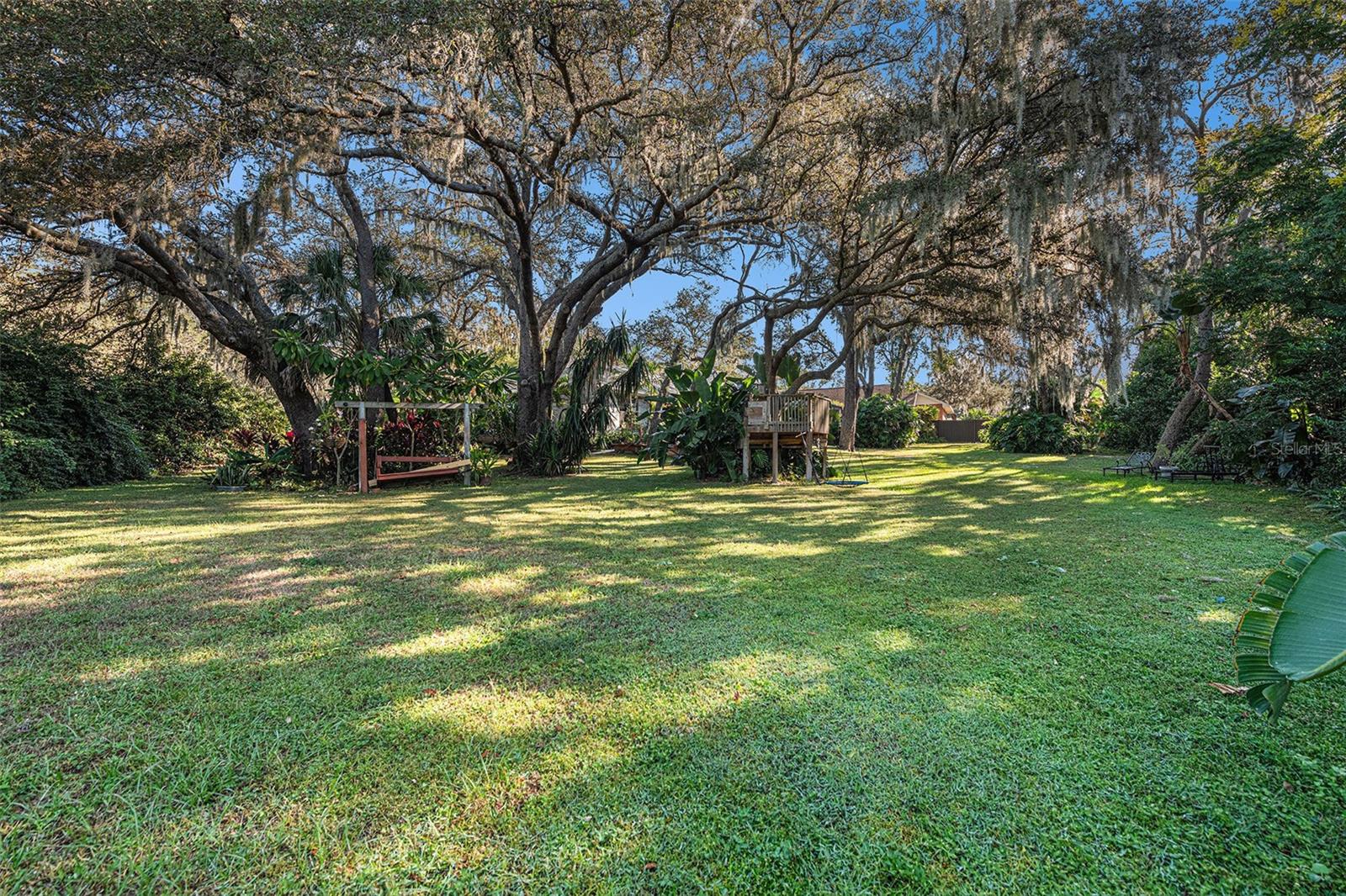 Lush, mature landscaping on almost 1/2 acre lot!