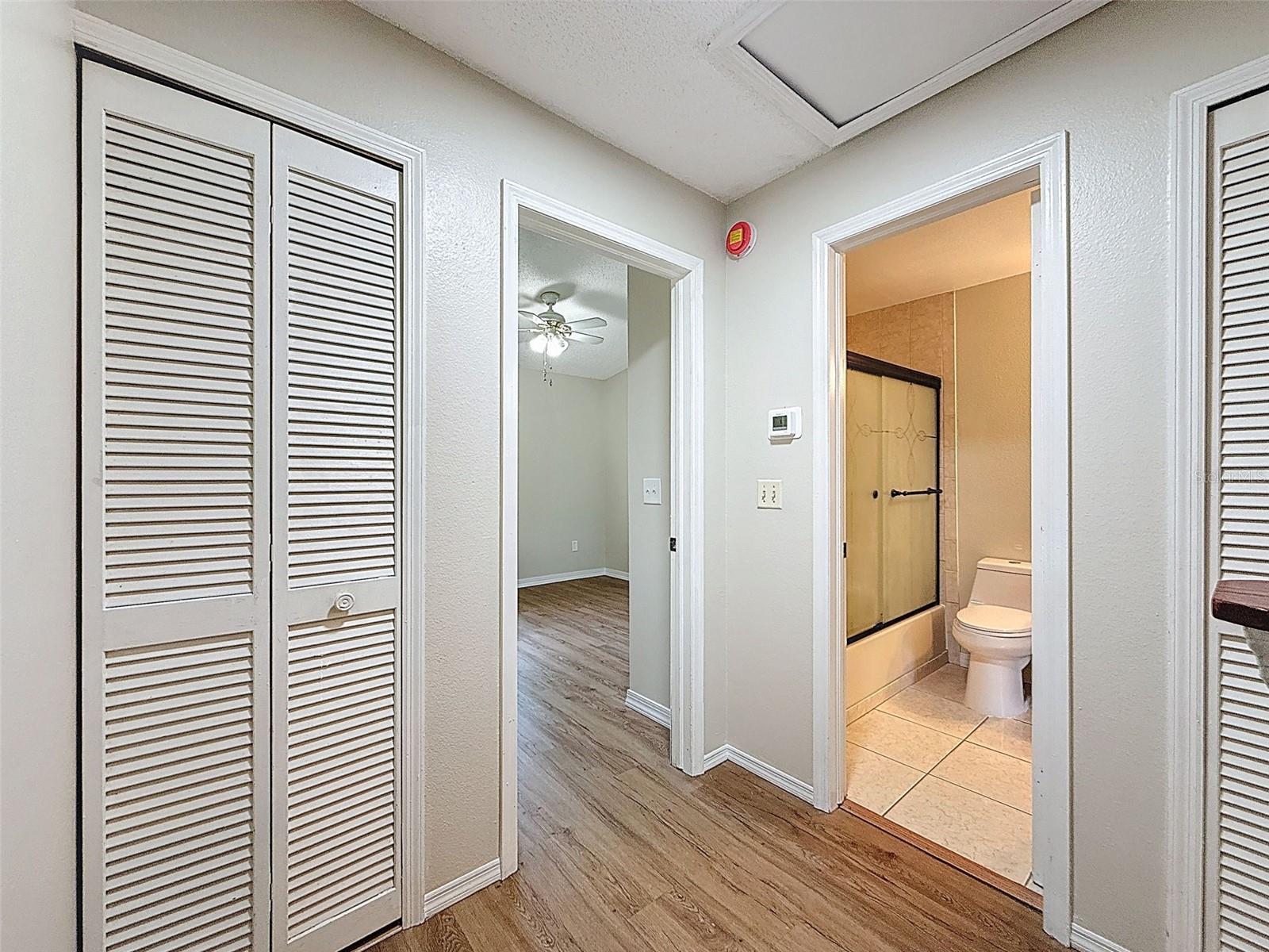 Upstairs hallway leading into bedroom and bathroom