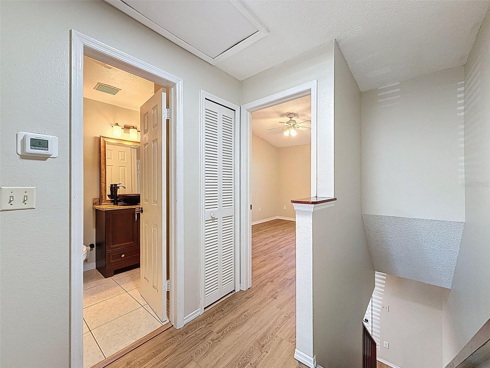 Upstairs hallway leading into bedroom and