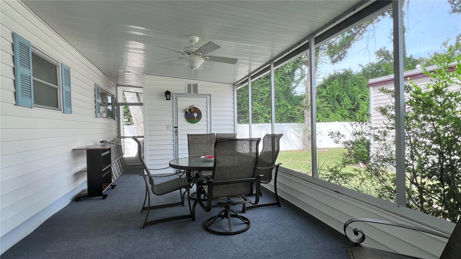 Side screen lanai under carport