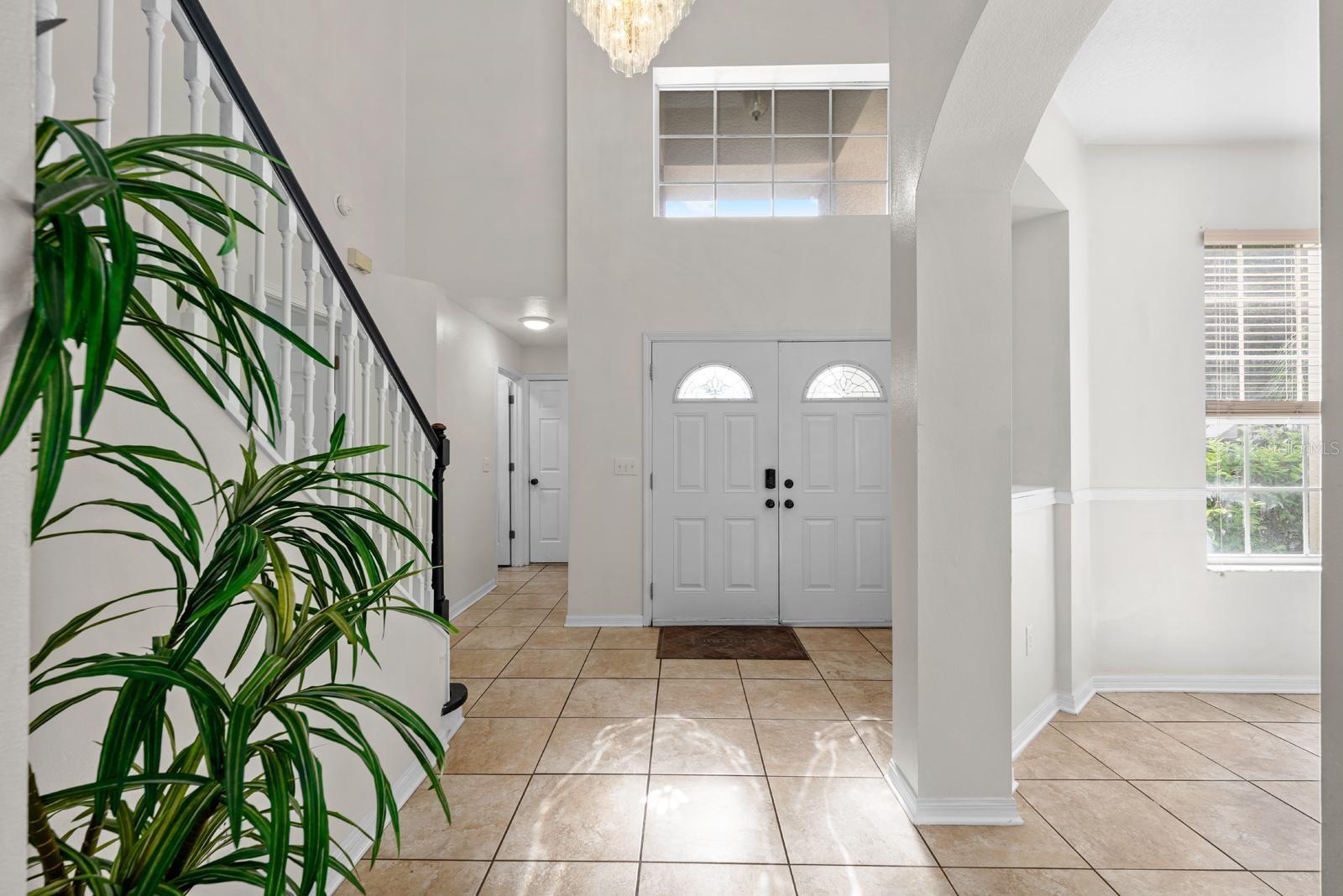 Grand entrance with two-story foyer