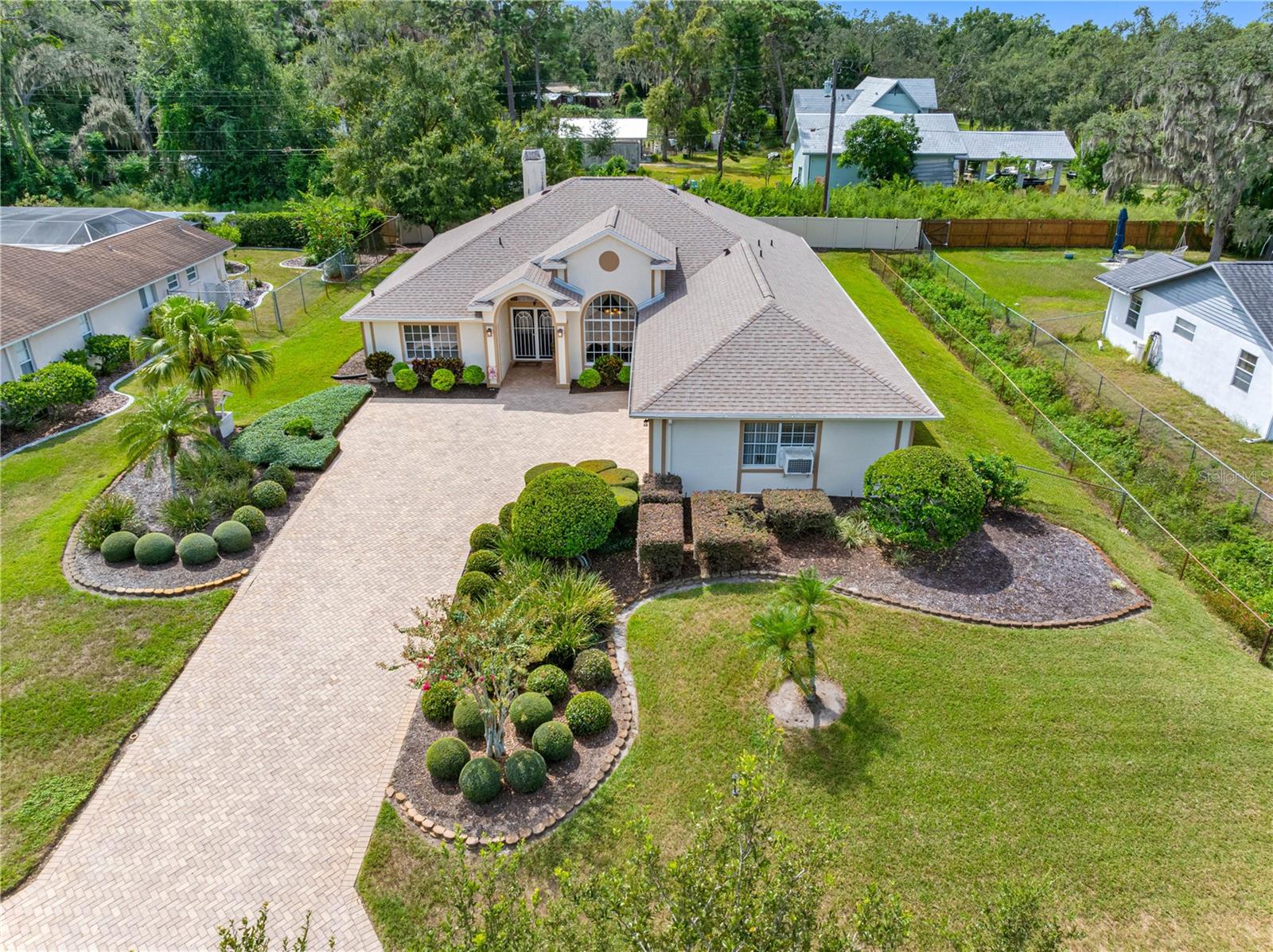 Manicured Yard & fenced Back