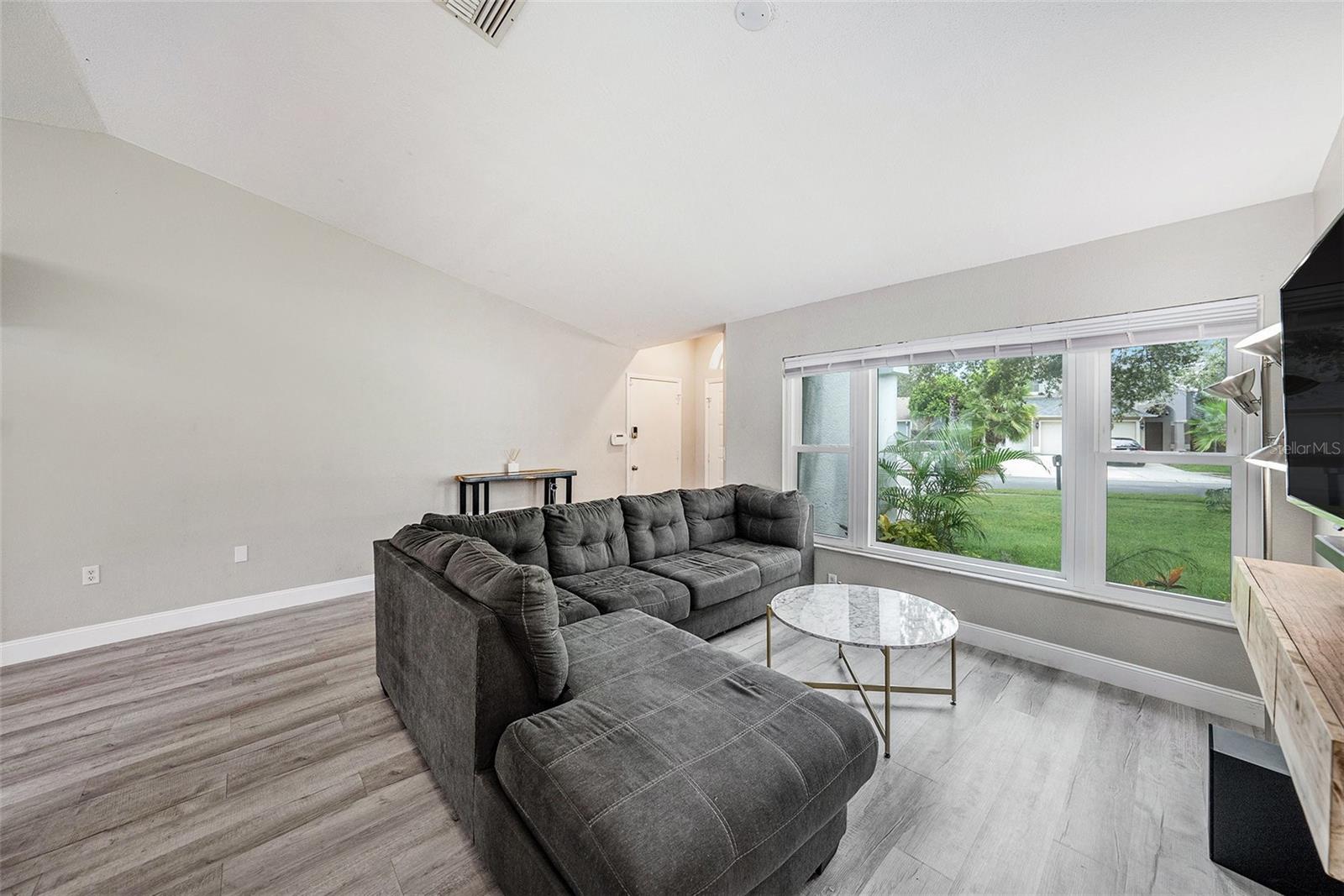 Lots of natural light in the living room from the large windows overlooking the front yard.