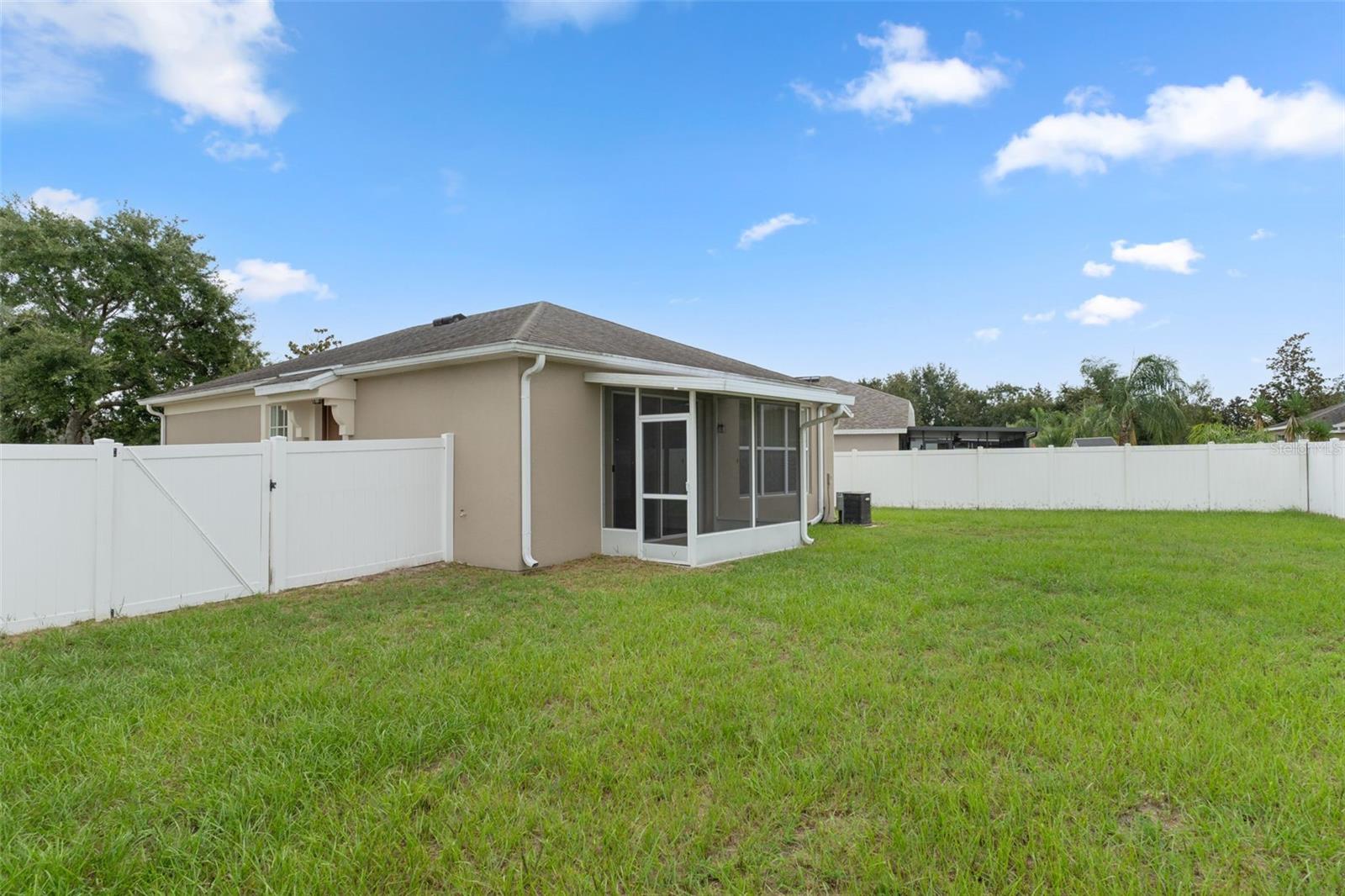 Vinyl Fenced Backyard with Screened Back Porch