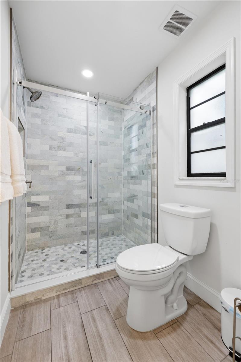 Remodeled Ensuite Primary Bathroom with Split Feature
