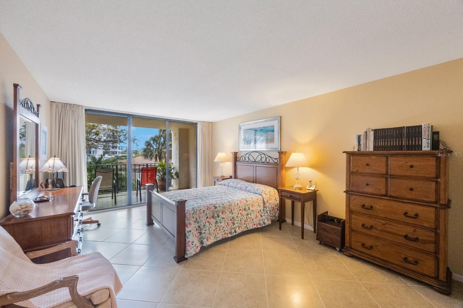 Primary bedroom with slider to lanai.