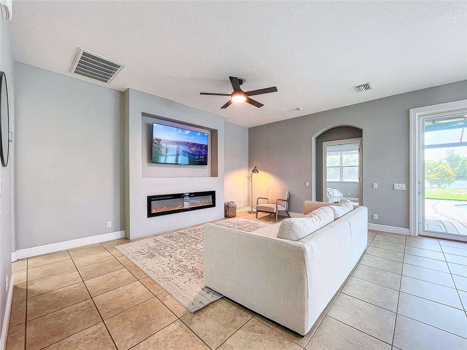 Family room, electric fireplace- Shown as it looked when the owner called it home.
