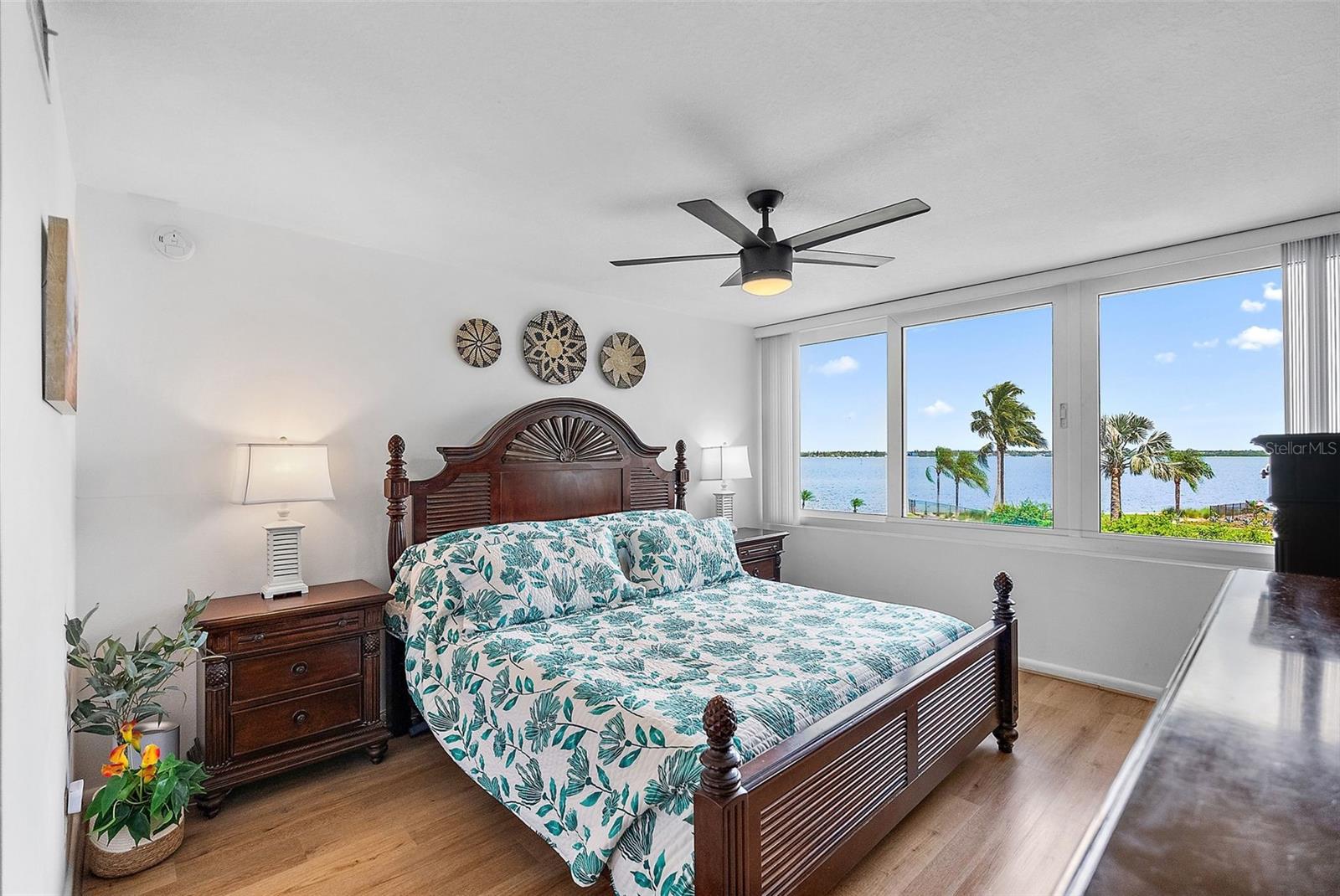 Primary suite with amazing views of Boca Ciega Bay.  Room features new Hurricane Impact Windows
