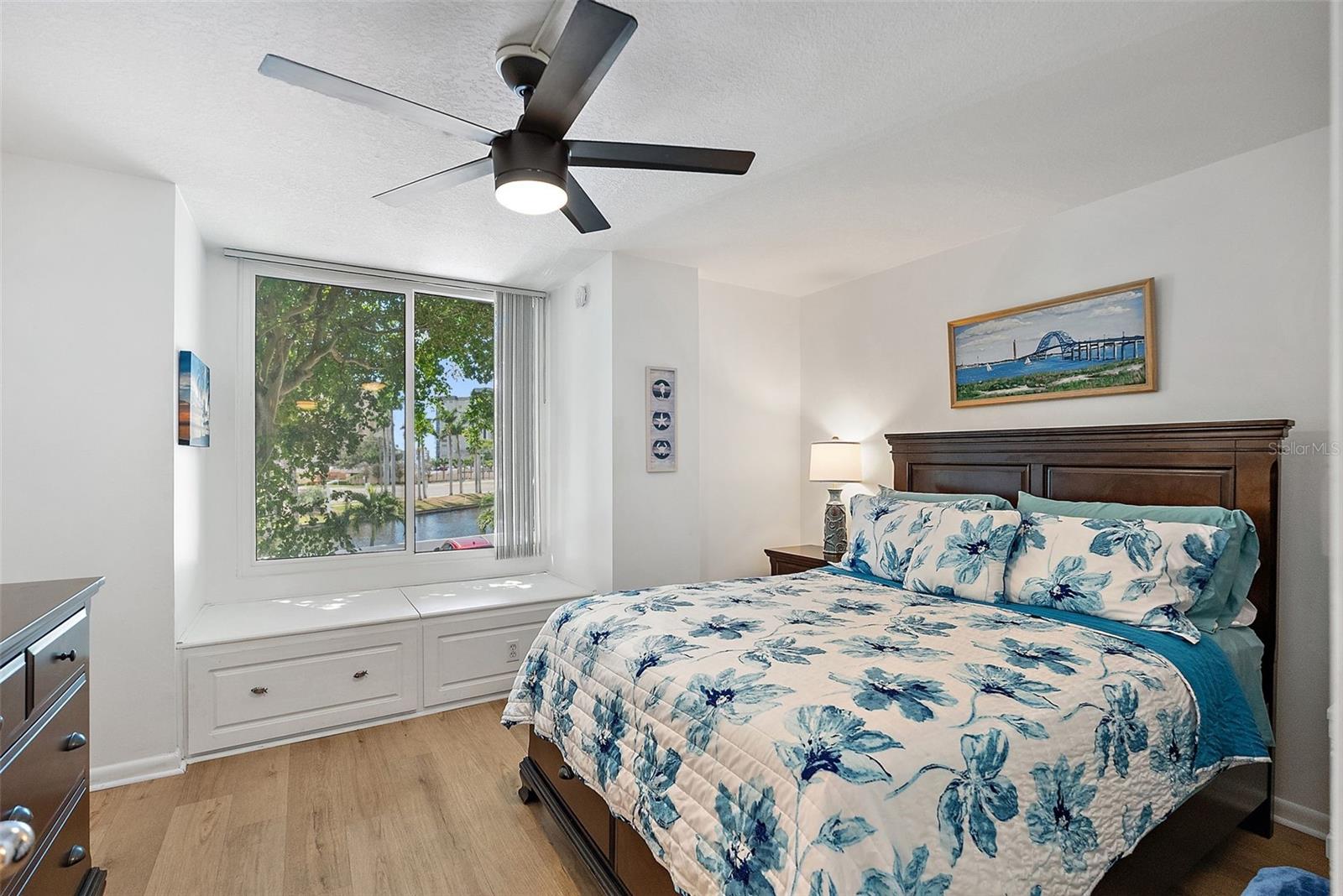 Guest Room with features walk-in closet, extra storage, new hurricane impact windows and fountain views