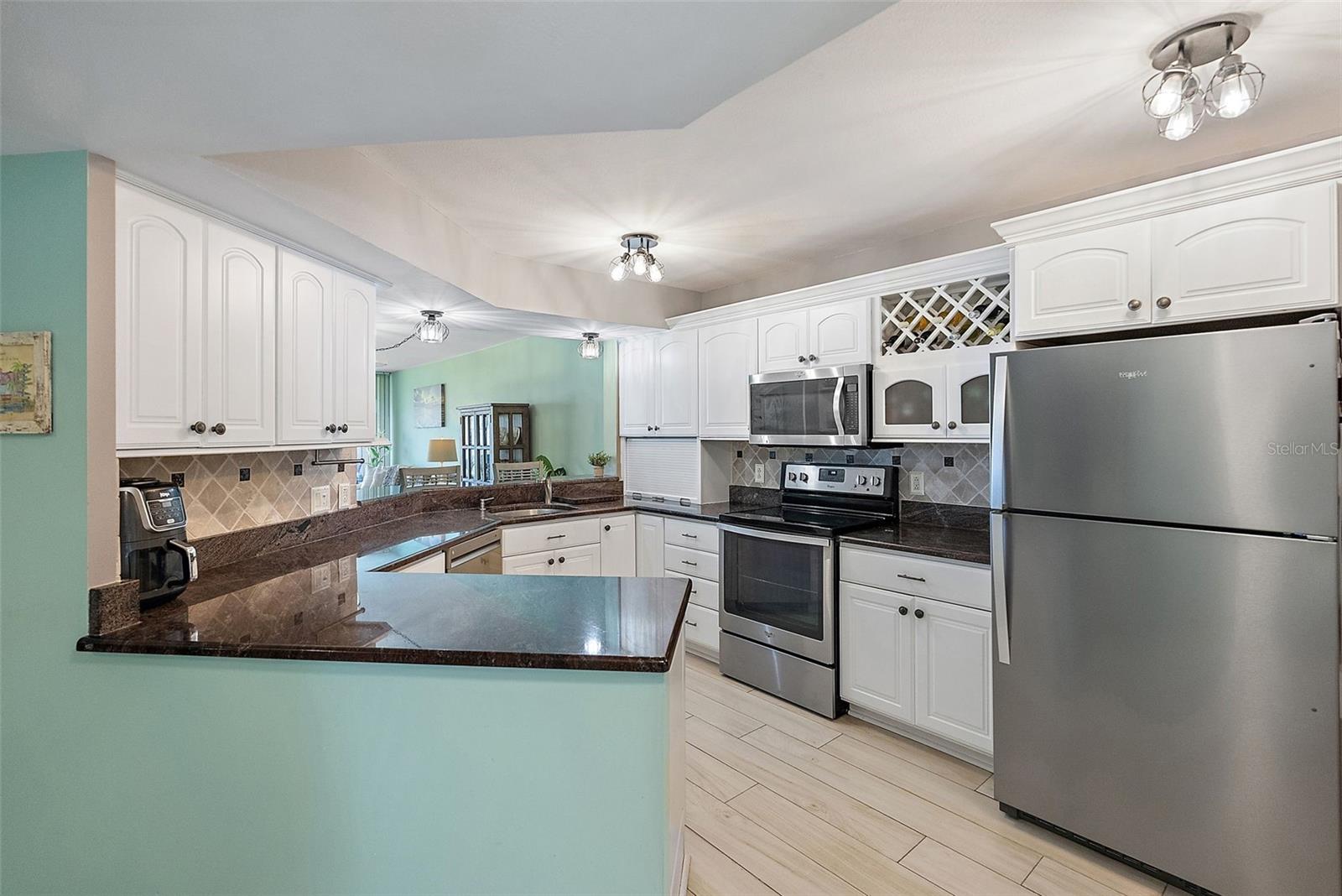 Kitchen has large amount of counter space and features a appliance garage to give kitchen a clutter free look.