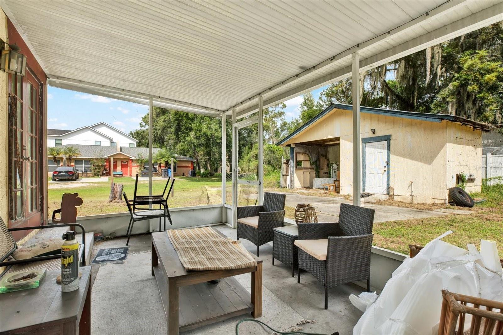 Screened in back patio / Shed