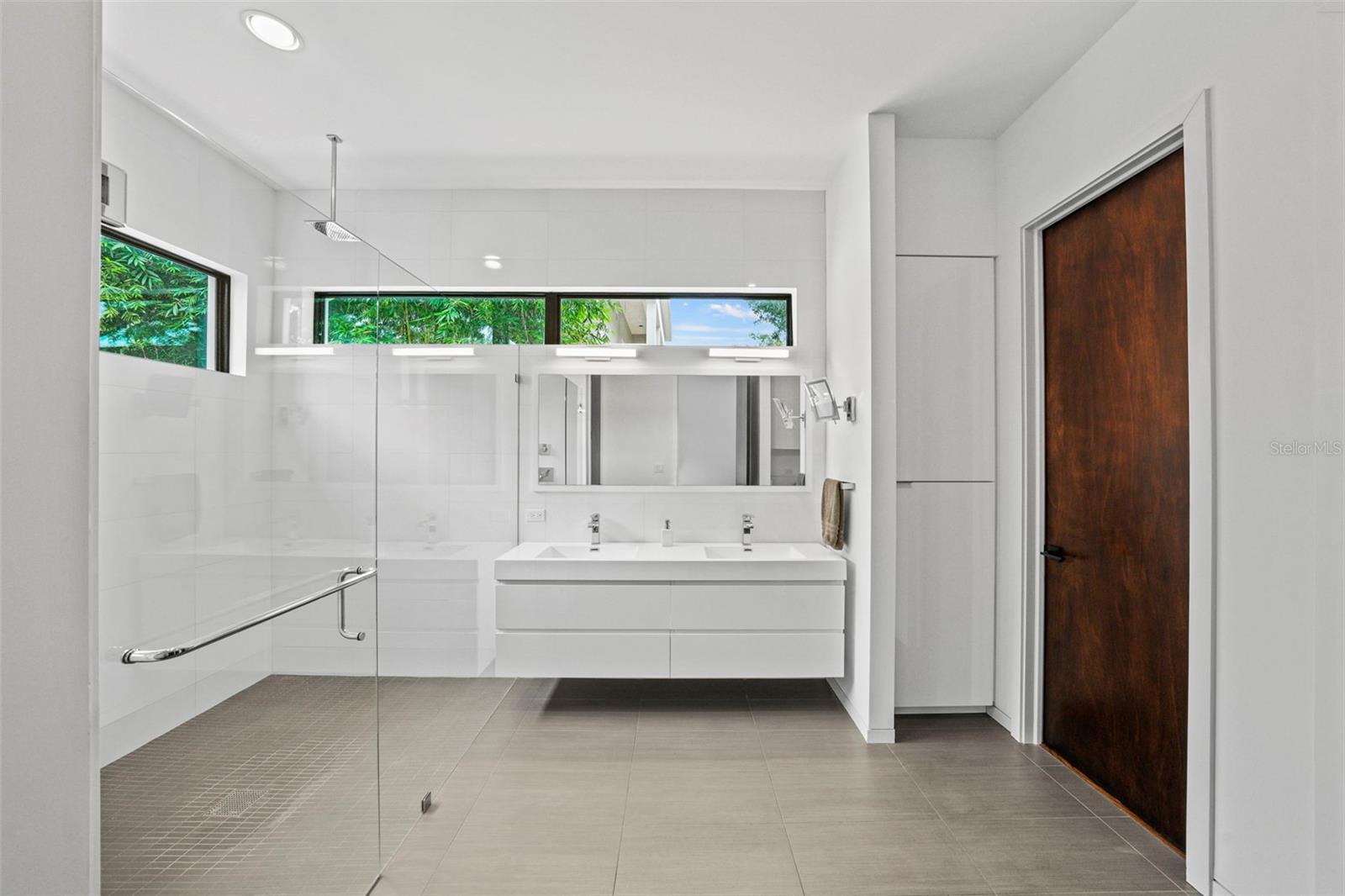 Primary bath features two walk in closets
