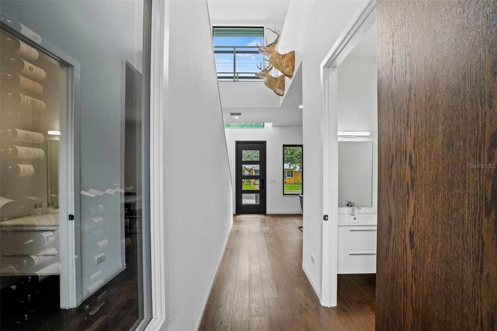 Home features tall ceilings, wood floors throughout and smooth walls