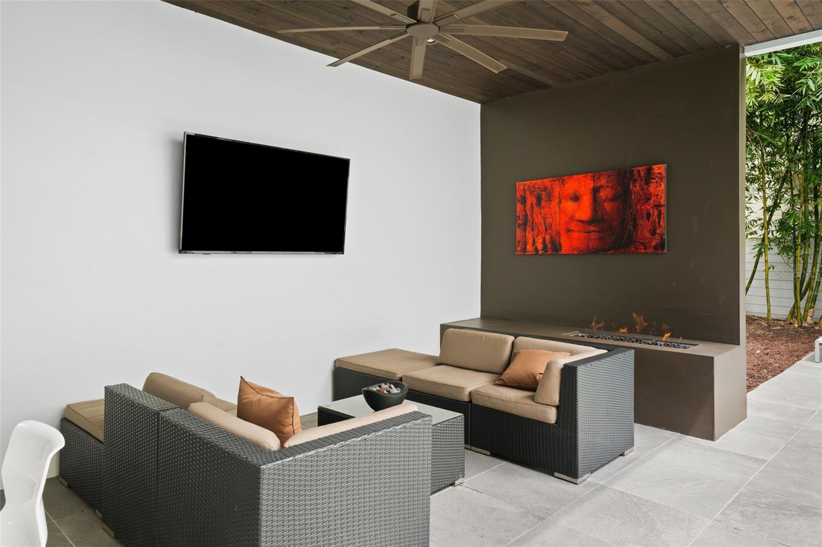 Note the fireplace and tongue and groove ceiling